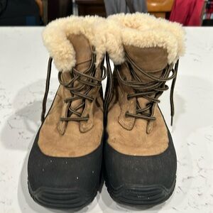 Slightly worn UGG cold/rain boots in a size 8.